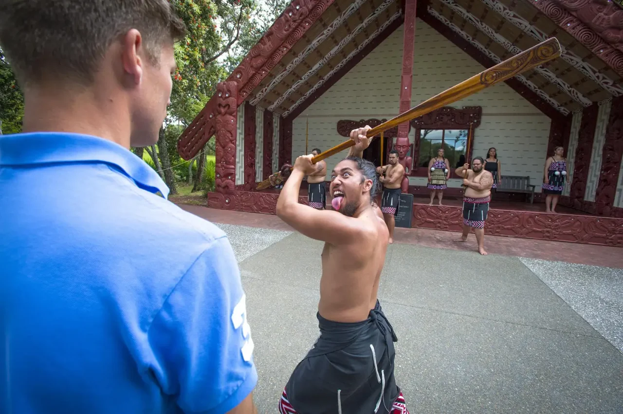 Person watching Performer at Carved Meeting House
