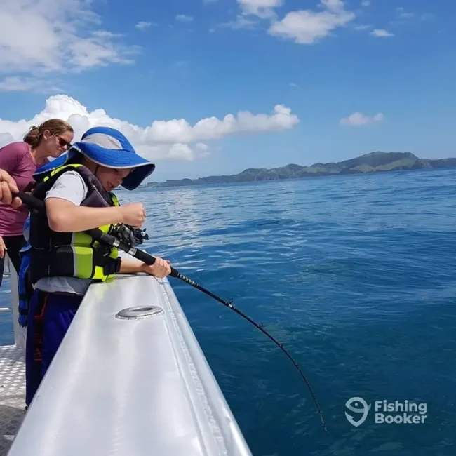 Boy fishing on Day Out Fishing Charters 